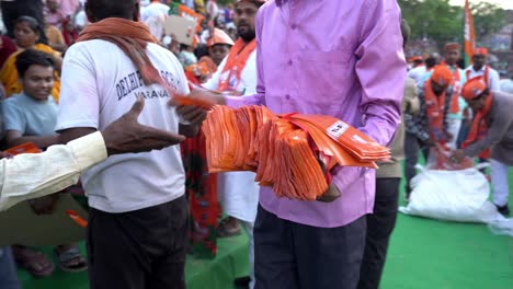 BJP-Lok-Sabha-election-campaign-public-event,-Namo-merchandise-distribution-among-people-by-party-workers