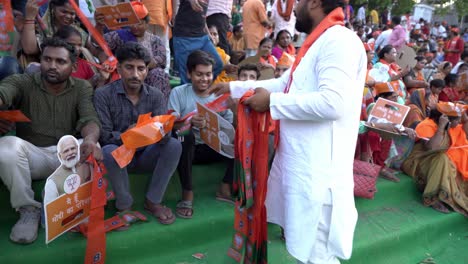 BJP-Lok-Sabha-election-campaign-public-event,-Namo-merchandise-distribution-to-people