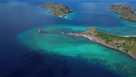 Indian-Ocean-sea-pristine-clear-water-with-coral-reef-in-Mohéli-or-Mwali,-part-of-the-Union-of-the-Comoros,-aerial-top-down-view