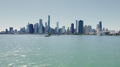 Aerial-Chicago-downtown-skyline-building-and-drone-view-along-skyscrapers-at-sunny-day-with-filing-bird