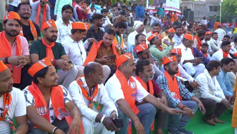 Crowd-of-Indian-voters-wearing-BJP-merchandise-gathered-at-Assi-ghat-to-attend-Chief-Minister-Yogi-Adityanath-Lok-Sabha-election-campaign-rally