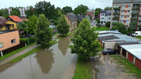 Flooded-city-Jelgava-in-Latvia-due-to-heavy-rain,-aerial-rising-establisher