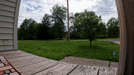 Timelapse-video-of-a-person-mowing-a-suburban-lawn,-capturing-the-process-from-start-to-finish-with-the-backdrop-of-a-quiet-neighborhood