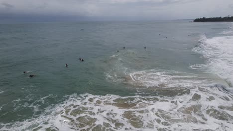 Surfer-riding-wave,-popular-surfing-spot-in-the-Caribbean-sea-Panama,-Bocas-del-Toro,-aerial