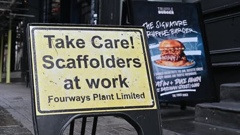 Take-Care,-Scaffolders-in-Soho,-London,-United-Kingdom