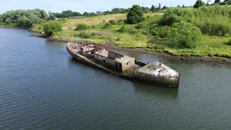 Aerial-orbit-shot-of-Cretehawser-Concrete-Shipwreck-on-banks-of-River-Wear---Sunderland,-UK