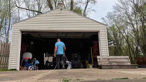 Timelapse-of-a-person-organizing-a-garage,-moving-bikes,-and-tidying-up