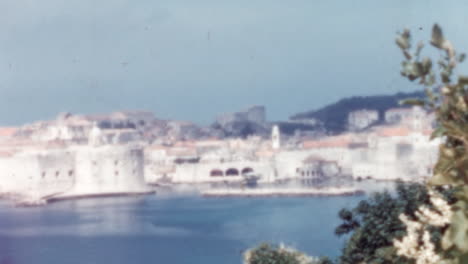 Panoramic-View-of-Dubrovnik-Medieval-Walls-and-Old-Harbor-on-Sunny-Day-1960s