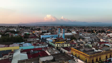 Aerial-view-approaching-the-Colegio-Franciscano-of-Huamantla,-sunset-in-Mexico