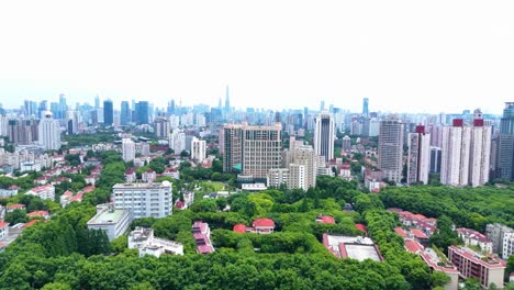 Drone-forward-shot-of-Shanghai-city-with-city-view-and-skyline-in-the-background