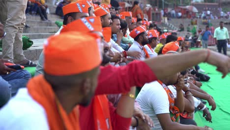 BJP-supporters-wearing-BJP-merchandise-gathered-to-attend-Chief-Minister-Yogi-Adityanath-Lok-Sabha-election-campaign-rally-at-Assi-Ghat