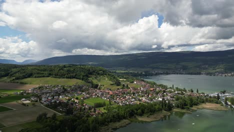 Erlach-city-town-lake-nature-landscape-in-Switzerland,-aerial-Berne-canton