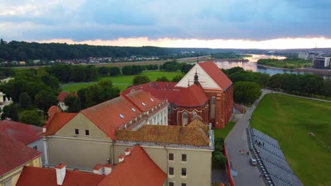 Old-Building-in-Kuanas,-Lithuania-with-Orange-Roof-Eroding-into-Brown