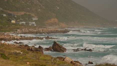 Slow-motion-shot-of-waves-breaking-at-Misty-Cliffs,-Cape-Town