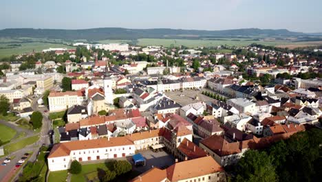 Aerial-View-Of-The-Old-Market-Square-In-Novy-Jicin-With-Church-of-the-Assumption-of-the-Virgin-Mary,-Czech-Republic