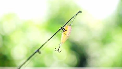 Yellow-fish-shaped-fishing-bait-with-treble-hook