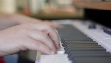 Male-Pianist-Hands-Playing-Multiple-Keys-on-Keyboard-Piano-in-Naturally-Lit-Recording-Studio-Environment