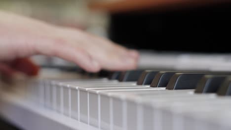 Close-Up-of-Male-Hands-of-Pianist-Artist-Gently-Playing-Music-Over-Variety-of-Keys