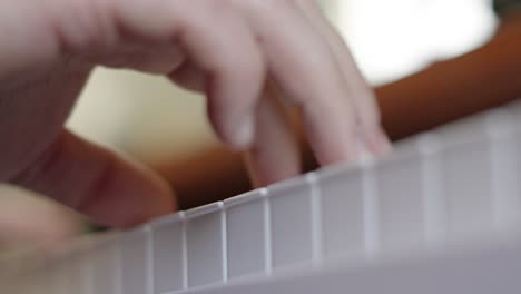 Close-Up-View-Below-of-Male-Hands-of-Pianist-Playing-Various-Chords,-Composing-Music-Concept