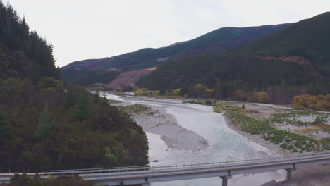 Aerial-drone-shot-of-a-bridge-crossing-the-Wairau-river-in-New-Zealand-South-Island