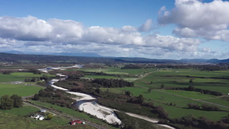 Aerial-drone-shot-over-the-green-countryside-near-Blackball,-South-Island-New-Zealand