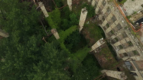 Dilapidated-Roofs-With-Rusty-Steam-Pipes-Over-Old-Abandoned-Factory-In-Italy