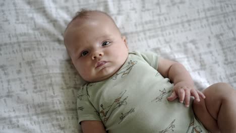 Baby-boy-playing-in-the-morning-on-the-floor