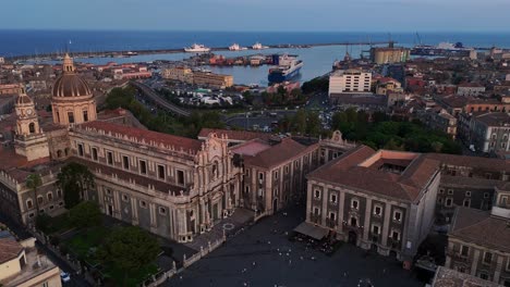 Catania's-historic-center-at-sunset-with-the-cathedral-basilica-of-saint-agatha,-aerial-view