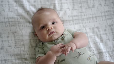 Baby-boy-playing-in-the-morning-on-the-floor