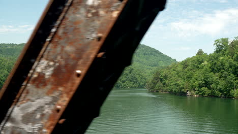 Smokey-Mountains-on-a-lake-in-the-summer-as-seen-from-a-scenic-train-bridge-ride,-North-Carolina,-Appalachia,-USA