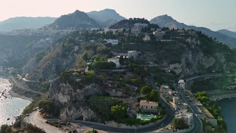 Coastal-hillside-with-buildings-and-winding-roads