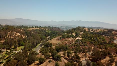 Aerial-flyover-of-Glendale-with-main-street-during-sunny-day-in-California