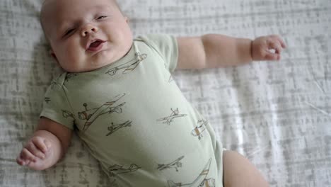 Baby-boy-playing-in-the-morning-on-the-floor