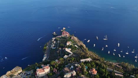 Coastal-town-with-boats-and-blue-sea-,-aerial-view