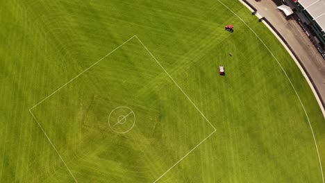 Lawn-mower-cutting-grass-in-stadium