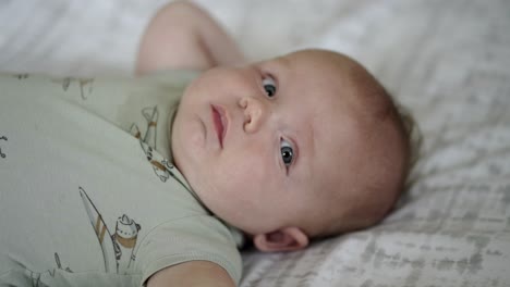 Baby-boy-playing-in-the-morning-on-the-floor