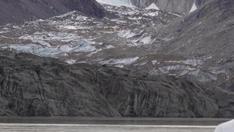 Establishing-shot-of-Patagonian-mountains-and-frozen-Cerro-Torre-lake