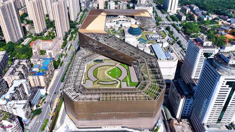 Drone-flight-over-Wushang-WS-Dream-Plaza,-World's-Largest-Single-Shopping-Mall-in-Wuhan-city,-China