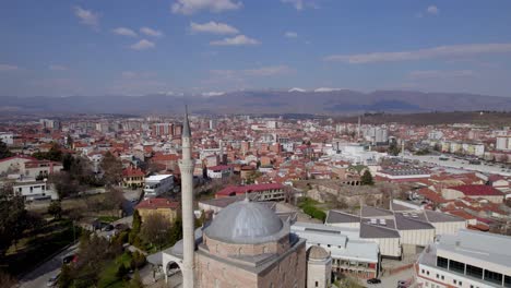 Drone-footage-unveiling-a-mosque-in-Skopje,-highlighting-its-architectural-beauty-and-city-surroundings