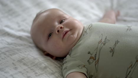 Baby-boy-playing-in-the-morning-on-the-floor