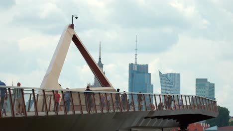 Pedestrians-stroll,-cyclists-glide-across,-journeys-towards-the-city