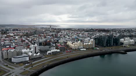 Aerial-footage-of-Reykjavik-shows-the-surrounding-landscape-and-the-city's-colorful-buildings