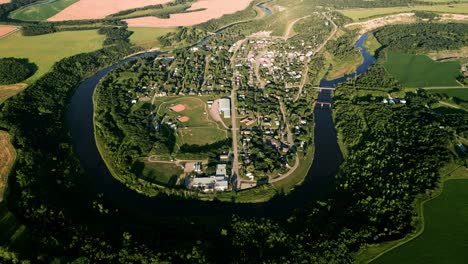 Aerial-Drone-Shot-of-the-Rural-Farming-Town-of-Wawanesa-Manitoba-at-Golden-Hour