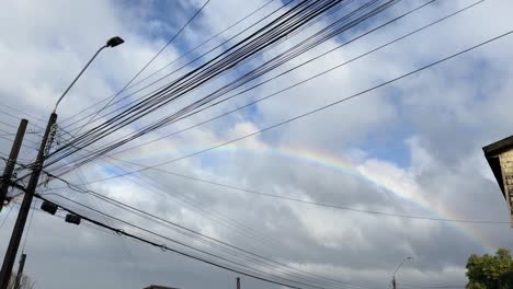 street-corner-light-cables-embellish-by-a-circular-southern-rainbow