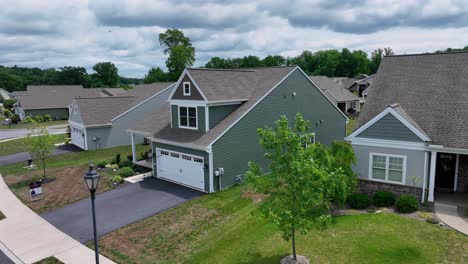 Aerial-approaching-shot-of-new-modern-houses-for-sale-in-american-neighborhood