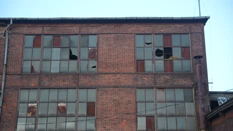 Old-derelict-building-with-shattered-windows-and-graffiti