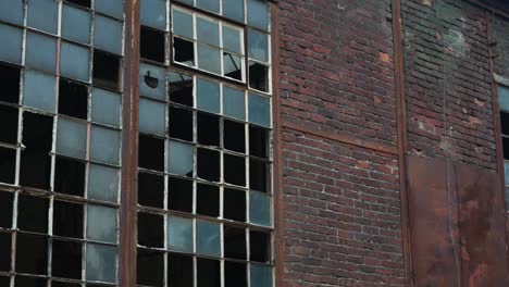 Abandoned-factory-with-broken-windows-and-old-bricks