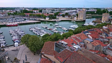 La-Rochelle-old-port-with-Saint-Nicolas-Tower-and-big-ferris-wheel-in-the-background