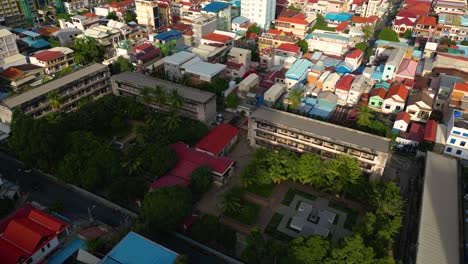 The-exterior-of-the-Tuol-Sleng-Genocide-Museum-in-Phnom-Penh-city,-Aerial-view