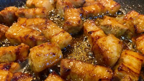 Close-up-of-seasoned-Belly-Pork-sizzling-in-oil-in-a-frying-pan